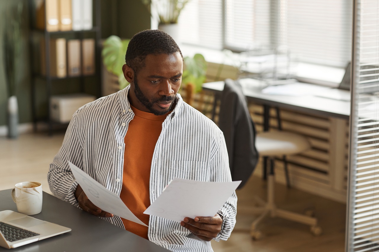 man-reading-documents.jpg