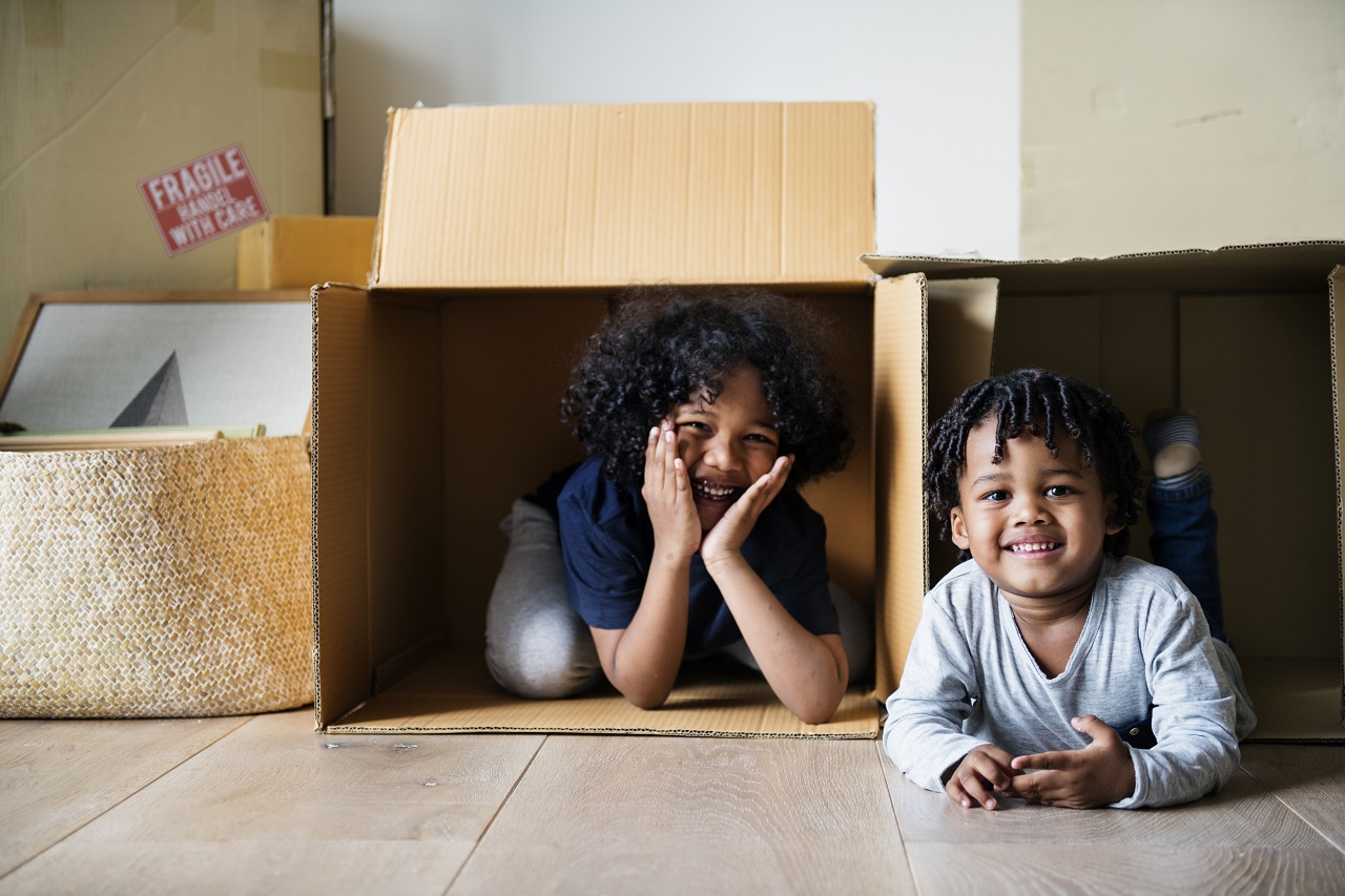 kids playing in moving boxes